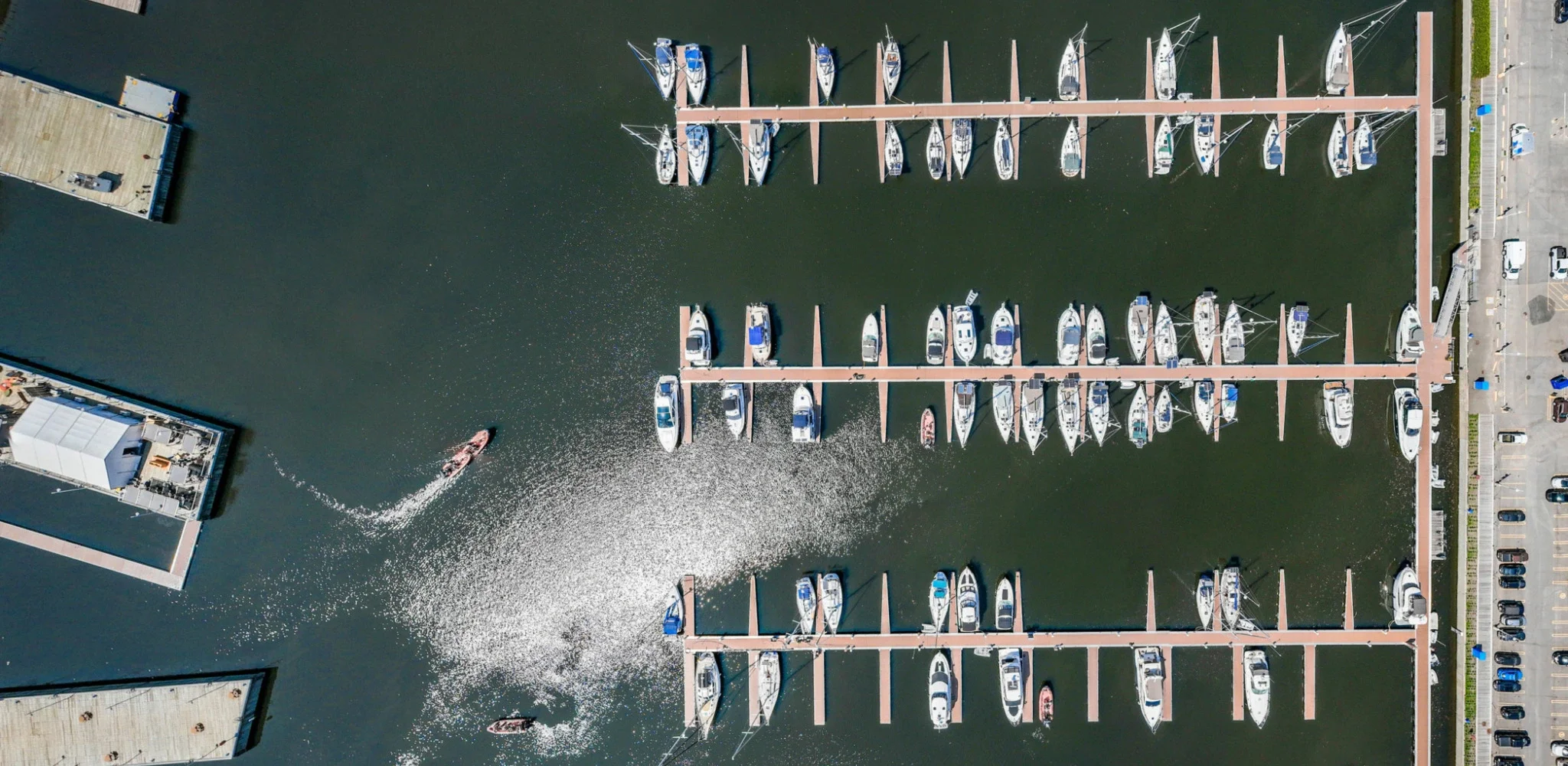 Aerial view of the marina with several boats docked.